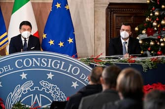 Italian premier Giuseppe Conte (L) and his spokesman Rocco Casalino (R) during the year-end press conference organized by the Order of Journalists (ODG) at Villa Madama, Rome, Italy, 30 December 2020. ANSA/RICCARDO ANTIMIANI