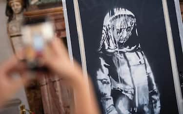 The Banksy stolen from the Bataclan theatre in Paris and found in Abruzzo exhibited at Palazzo Farnese on the occasion of the French national day. Then it will be returned to France, Rome, Italy, 14 July 2020. The work of the English street artist, depicting the "sad girl", painted on the door of the emergency exit of the Bataclan theater in homage to the victims of the terrorist massacres in Paris, had been removed and stolen in January 2019. It was found in Italy last June 10 after an 'activity of judicial and police cooperation. ANSA/CLAUDIO PERI