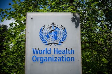 This picture taken on April 24, 2020 shows a sign of the World Health Organization (WHO) in Geneva next to their headquarters, amid the COVID-19 outbreak, caused by the novel coronavirus. (Photo by Fabrice COFFRINI / AFP) (Photo by FABRICE COFFRINI/AFP via Getty Images)