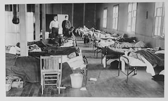 906330984 View of victims of the Spanish flu cases as they lie in beads at a barracks hospital on the campus of Colorado Agricultural College, Fort Collins, Colorado, 1918. (Photo by American Unofficial Collection of World War I Photographs/PhotoQuest/Getty Images)