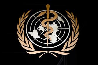1210710940 A picture taken on March 9, 2020 shows the logo of the World Health Organization (WHO) at the entrance of their headquarters in Geneva, amid the COVID-19 outbreak, caused by the novel coronavirus. (Photo by Fabrice COFFRINI / AFP) (Photo by FABRICE COFFRINI/AFP via Getty Images)