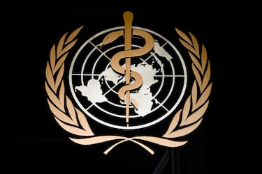 A picture taken on March 9, 2020 shows the logo of the World Health Organization (WHO) at the entrance of their headquarters in Geneva, amid the COVID-19 outbreak, caused by the novel coronavirus. (Photo by Fabrice COFFRINI / AFP) (Photo by FABRICE COFFRINI/AFP via Getty Images)