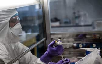 A scientist is at work in the VirPath university laboratory, classified as "P3" level of safety, on February 5, 2020 as they try to find an effective treatment against the new SARS-like coronavirus, which has already caused more than 560 deaths. - When most are busy developing vaccines or testing the few anti-virals available, VirPath will go after drugs used for diseases that have nothing to do with a respiratory infection such as 2019-nCoV. (Photo by JEFF PACHOUD / AFP) (Photo by JEFF PACHOUD/AFP via Getty Images)