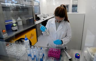 A scientist works at the mAbxience biosimilar monoclonal antibody laboratory plant in Garin, Buenos Aires province, on August 14, 2020, where an experimental coronavirus vaccine will be produced for Latin America. - Argentina will manufacture while Mexico will pack and distribute in Latin America, except of Brazil, the vaccine against COVID-19 developed by the University of Oxford and the AstraZeneca laboratory. (Photo by JUAN MABROMATA / AFP) (Photo by JUAN MABROMATA/AFP via Getty Images)