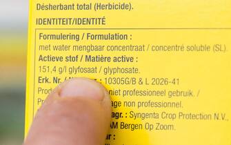 epa07419822 (FILE) - A person points at the ingredient list on a box of herbicide which contains glyphosate, at a garden store in Brussels, Belgium, 23 October 2017 (reissued 07 March 2019). The EU Court of Justice's General Court in Luxembourg has ruled on 07 March 2019 that the European Food Safety Authority (EFSA), the EU food watchdog, must disclose studies on the toxicity and carcinogenic properties of glyphosate, the world's most commonly used herbicide that sparked controversy in the EU over safety evaluations.  EPA/STEPHANIE LECOCQ