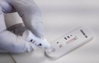 1226434171 CATANIA, ITALY - MAY 22: A rapid serological test is carried out in the molecular biology laboratory of Cannizzaro Hospital on May 22, 2020 in Catania, Italy. Restaurants, bars, cafes, hairdressers and other shops have reopened, subject to social distancing measures, after more than two months of a nationwide lockdown meant to curb the spread of Covid-19. (Photo by Fabrizio Villa/Getty Images)