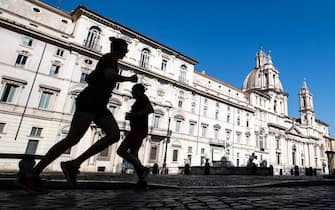 A runner in Piazza Navona empties on Easter holiday during the emergency blockade of the Coronavirus Covid-19 in Rome, Italy, 12 April 2020. ANSA/ANGELO CARCONI