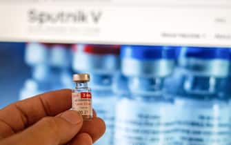 In this photo illustration a vial that contained the second dose of Sputnik V vaccine is displayed against a computer screen with info about the Sputnik V vaccine.As part of the COVID-19 vaccination campaign, Argentina is applying this second dose to healthcare workers all over the country to complete the immunization. - Patricio Murphy / SOPA Images//SOPAIMAGES_sopa011251/2101260845/Credit:SOPA Images/SIPA/2101260851
