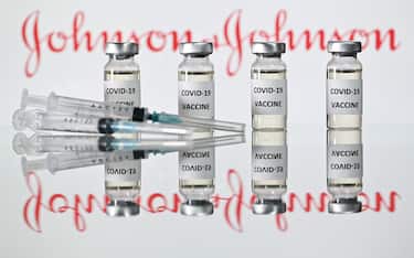 A file photo taken on November 17, 2020 shows vials with Covid-19 Vaccine stickers attached and syringes with the logo of US pharmaceutical company Johnson &amp; Johnson.&nbsp; (Photo by JUSTIN TALLIS / AFP)