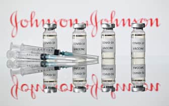 (FILES) A file photo taken on November 17, 2020 shows vials with Covid-19 Vaccine stickers attached and syringes with the logo of US pharmaceutical company Johnson & Johnson. - The Johnson & Johnson vaccine is highly effective against severe Covid-19, including against the South African and Brazil variants, new documents released by the US Food and Drug Administration showed on February 24, 2021. In large clinical trials, the vaccine efficacy against severe disease was 85.9 percent in the United States, 81.7 percent in South Africa, and 87.6 percent in Brazil. (Photo by JUSTIN TALLIS / AFP)