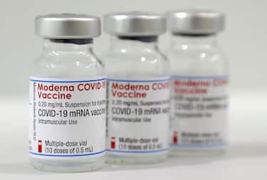 epa09017674 Three vials of the 'Moderna COVID-19 Vaccine' are pictured in a new coronavirus COVID-19 vaccination center at the 'Velodrom' stadium in Berlin, Germany, 17 February 2021.  EPA/MICHAEL SOHN / POOL