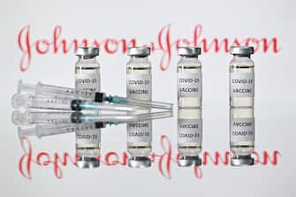 (FILES) A file photo taken on November 17, 2020 shows vials with Covid-19 Vaccine stickers attached and syringes with the logo of US pharmaceutical company Johnson & Johnson. - The Johnson & Johnson vaccine is highly effective against severe Covid-19, including against the South African and Brazil variants, new documents released by the US Food and Drug Administration showed on February 24, 2021. In large clinical trials, the vaccine efficacy against severe disease was 85.9 percent in the United States, 81.7 percent in South Africa, and 87.6 percent in Brazil. (Photo by JUSTIN TALLIS / AFP)