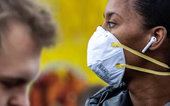 NEW YORK, NY - MARCH 09: A woman wearing a protective mask is seen in Union Square on March 9, 2020 in New York City. There are now 20 confirmed coronavirus cases in the city including a 7-year-old girl in the Bronx. (Photo by Jeenah Moon/Getty Images)