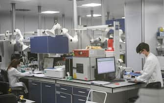 Technicians at work in the laboratory of the Latina office of BSP Pharmaceuticals, 9 February 2021. ANSA / Maurizio Brambatti