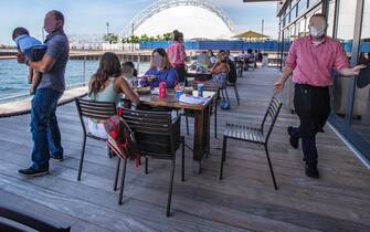 BOSTON, MA - JUNE 11: Father's Day dining on the deck at Legal Harborside in Boston on June 21, 2020. (Photo by Stan Grossfeld/The Boston Globe via Getty Images)