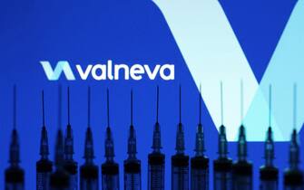 Medical syringes are pictured in front of the Valneva lolgo of a French biotech company in this photo illustration, taken in Kyiv, Ukraine on May 13, 2021. The World Health Organization has approved for emergency use of China's Sinopharm COVID-19 coronavirus vaccine, and in total, WHO has now registered 6 vaccines for SARS-CoV-2, as media reported. 
 (Photo by Alex Chitaro/Sipa USA)