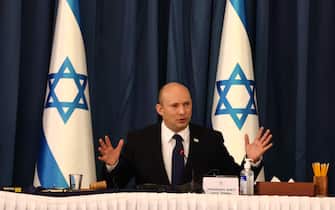 epa09405805 Israeli Prime Minister Naftali Bennett speaks at the weekly cabinet meeting at the Foreign Ministry in Jerusalem, 08 August 2021.  EPA/RONEN ZVULUN / POOL