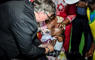 World Health Organisation representative to Kenya Dr. Ruddi Eggers vaccinates a child in Ndhiwa, Homabay County, western Kenya on September 13, 2019 during the launch of malaria vaccine in Kenya. - The vaccine (Mosquirix) is the world's first malaria vaccine that has been shown to provide partial protection against malaria in young children and has been rolled out by World Health Organisation in Kenya, Ghana and Malawi. (Photo by Brian ONGORO / AFP) (Photo by BRIAN ONGORO/AFP via Getty Images)