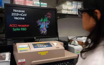 Dr. Nita Patel, Director of Antibody discovery and Vaccine development, looks at a computer model showing the protein structure of a potential coronavirus, COVID-19, vaccine at Novavax labs in Gaithersburg, Maryland on March 20, 2020, one of the labs developing a vaccine for the coronavirus, COVID-19. (Photo by ANDREW CABALLERO-REYNOLDS / AFP) / The erroneous mention[s] appearing in the metadata of this photo by ANDREW CABALLERO-REYNOLDS has been modified in AFP systems in the following manner: [Gaithersburg] instead of [Rockville]. Please immediately remove the erroneous mention[s] from all your online services and delete it (them) from your servers. If you have been authorized by AFP to distribute it (them) to third parties, please ensure that the same actions are carried out by them. Failure to promptly comply with these instructions will entail liability on your part for any continued or post notification usage. Therefore we thank you very much for all your attention and prompt action. We are sorry for the inconvenience this notification may cause and remain at your disposal for any further information you may require. (Photo by ANDREW CABALLERO-REYNOLDS/AFP via Getty Images)