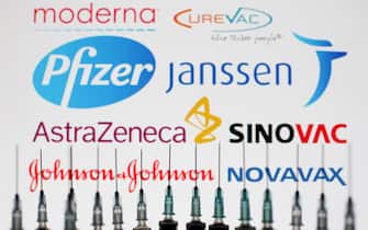 Medical syringes are pictured in front of Moderna, CureVac, Pfizer, Janssen, AstraZaneca, Sinovac, Novavax and Johnson & Johnson logos in this photo illustration, taken in Kyiv, Ukraine on May 13, 2021. The World Health Organization has approved for emergency use of China's Sinopharm COVID-19 coronavirus vaccine, and in total, WHO has now registered 6 vaccines for SARS-CoV-2, as media reported. 
 (Photo by Alex Chitaro/Sipa USA)