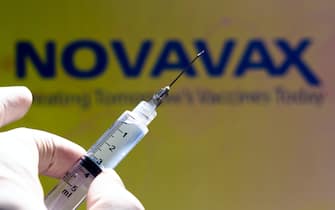 In this photo illustration the medical syringe is seen with Novavax company logo displayed on a screen in the background (Photo by Rafael Henrique / SOPA Images/Sipa USA)