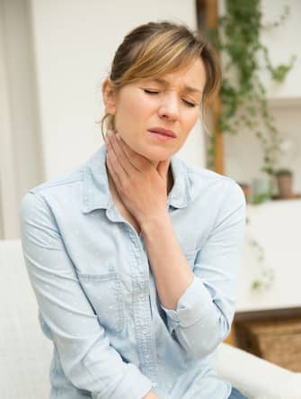 Woman suffering from sore throat. (Photo by: BSIP/Universal Images Group via Getty Images)