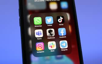 25 January 2021, Berlin: The logos of social media platforms WhatsApp (l-r), Twitter, TikTok, Microsoft Teams, Clubhouse, Facebook, Instagram, Slack and Telegram are seen on an iPhone 12 Pro Max. Photo: Christoph Dernbach/dpa