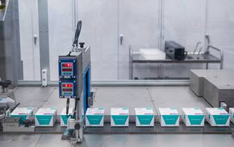 Packages of a test production are pictured on the assembly line for automatic packaging at the manufacturing facility of pharmaceutical company AstraZeneca for biological medicines in Södertälje, south of Stockholm, Sweden on February 8, 2022. - AstraZenecas new facility in Sweden located in Södertälje was inaugurated last December and is dedicated to the production of next generation biological drugs such as Evusheld, a Covid-19 preventative monoclonal antibody treatment for immunocompromised people.  (Photo by Jonathan NACKSTRAND / AFP) (Photo by JONATHAN NACKSTRAND/AFP via Getty Images)