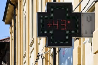 A pharmacy sign displays a temperature of 43 degrees Celsius on June 27, 2019 in Reggio Emilia, near Bologna, northern Italy. - Europeans braced on June 27 for the expected peak of a sweltering heatwave that has sent temperatures soaring above 40 degrees Celsius, with schools in France closing and wildfires in Spain spinning out of control. (Photo by Miguel MEDINA / AFP)        (Photo credit should read MIGUEL MEDINA/AFP via Getty Images)