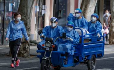 Health workers ride on cargo motorcycle prior to a lockdown lifting in Shanghai, China, 31 May 2022. The Shanghai Government on 30 May announced the lifting of most restrictions starting 01 June 2022. All residents will be able to leave their compounds freely without using any passes, except those living in medium and high-risk areas. Inner-city public transportation and taxis will also resume operation. Residents will be allowed to move freely using their own vehicles, however, they will still need to submit an application to authorities in order to leave the city.  ANSA/ALEX PLAVEVSKI