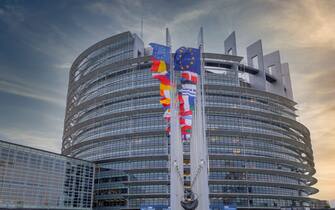 Vino European flags in the wind, Louise-Weiss building, seat of the European Parliament in Strasbourg, France, Europe