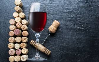 Wine corks in the shape of wine bottle on the graphite background.