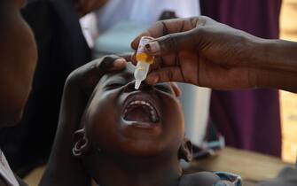 January 14, 2022, Kampala, Uganda: A child receives a polio vaccine in Kampala, Uganda, as the African country started a three-day nationwide polio immunization exercise targeting over 8.8 million children under the age of five years. (Credit Image: © Nicholas Kajoba/Xinhua via ZUMA Press)