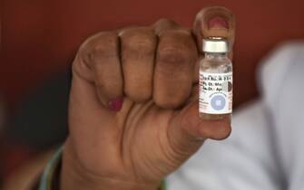 32164141 A Health worker showing a vial polio vaccine at a housing society on January 31, 2021 in Jammu, India is observing Polio National Immunization Day (NID) today where drops are administered to children of less than 5 years of age to keep the disease at bay. The health ministry said that pulse polio immunization will be taken up on January 31, February 1 and 2. (Photo by Bikas Bhagat / INA Photo Agency / Sipa USA)