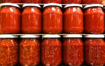 View of organic tomato paste in jars ready for winter.