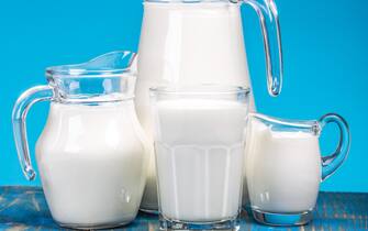 Natural fresh milk on blue background