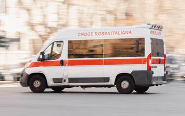 Quarantine Roma Italy emergency move car save patient from coronavirus covid. Inscription Ambulanza on ambulance