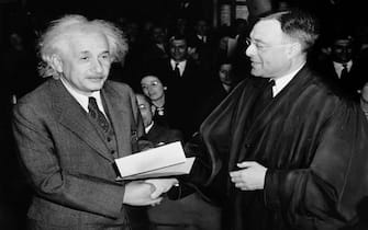 Albert Einstein receiving his certificate of American citizenship from Judge Phillip Forman on October 1st 1940. Einstein portrait.