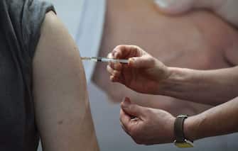 A flu vaccination is injected on the arm of German Health Minister Jens Spahn in Berlin on October 29, 2019. (Photo by Tobias SCHWARZ / AFP) (Photo by TOBIAS SCHWARZ/AFP via Getty Images)