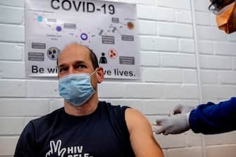 Professor Francois Venter (L) receives an experimental vaccine for COVID-19 coronavirus at the Respiratory & Meningeal Pathogens Research Unit (RMPRU) at Chris Hani Baragwanath Hospital in Soweto, on July 14, 2020. - Six senior clinicians in the Faculty of Health Sciences at Wits University have volunteered to participate in South Africas first COVID-19 vaccine trial. (Photo by Luca Sola / AFP) (Photo by LUCA SOLA/AFP via Getty Images)
