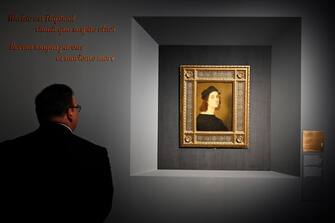 A visitor looks at the painting "Self Portrait" by Renaissance master Raffaello Sanzio da Urbino, known as Raphael, on March 4, 2020, displayed at the exhibition "Raffaello" at the Scuderie del Quirinale in Rome. - The exhibition, marking 500 years since the death of the Italian master, runs from March 5 to June 2, 2020. (Photo by Alberto PIZZOLI / AFP) (Photo by ALBERTO PIZZOLI/AFP via Getty Images)