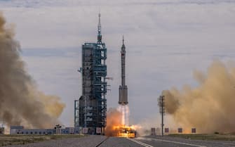CHINA SPACE PROGRAMS SHENZHOU-12 epa09278499 The Long March-2F carrier rocket, carrying the Shenzhou-12, takes off from the launch site at the Jiuquan Satellite Launch Center, in the Gobi Desert, Inner Mongolia, near Jiuquan, China, 17 June 2021. China launched the Shenzhou-12 spacecraft carrying three crew members Tang Hongbo, Nie Haisheng, and Liu Boming to the orbiting Tianhe core module for a three-month mission on 17 June. The mission is China's first manned spaceflight in almost five years. EPA/ROMAN PILIPEY