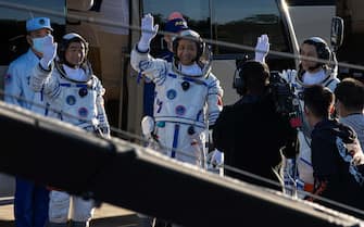 CHINA SPACE PROGRAMS SHENZHOU12 epa09278428 Chinese astronauts Tang Hongbo, Nie Haisheng, and Liu Boming wave during a departure ceremony before the launch of the Long March-2F carrier rocket, carrying the Shenzhou-12 at the Jiuquan Satellite Launch Center, in the Gobi Desert, northwest of China, 17 June 2021. China launches Shenzhou-12 spacecraft carrying three crew members Tang Hongbo, Nie Haisheng, and Liu Boming to the orbiting Tianhe core module for a three-month mission on 17 June. It is the first spaceflight in almost five years where China sends humans into space. EPA/ROMAN PILIPEY