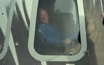 epa09355037 A handout photo made available by Blue Origin shows Jeff Bezos (R) reacting inside the capsule after Blue Origin New Shepard with Jeff Bezos, Mark Bezos, Wally Funk and Oliver Daemen returned to earth following a trip to space after lift off from Launch Site One, Texas, USA, 20 July 2021.  EPA/BLUE ORIGIN / HANDOUT  HANDOUT EDITORIAL USE ONLY/NO SALES
