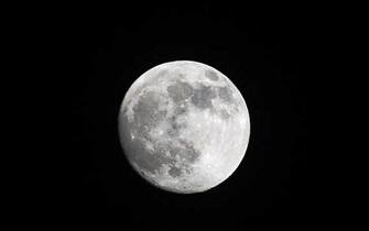 Milan - almost full moon after the snowfall (Milan - 2020-12-28, Maurizio Maule) ps the photo can be used in compliance with the context in which it was taken, and without the defamatory intent of the decorum of the people represented