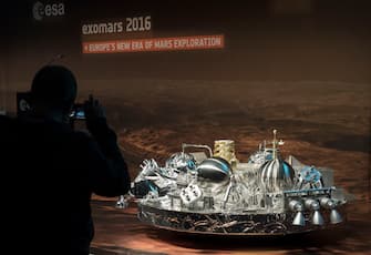 A man photographs the model in scale 1:3 of the landing unit Schiaparelli of the European-Russian ExoMars 2016 mission at the European Space Agency (ESA) space operation center (ESOC) in Darmstadt, Germany, on October 19, 2016. 
Europe is set to place a small lander on Mars and a gas-sniffing craft in its orbit as part of a mission with Russia to scour the Red Planet for signs of life. / AFP / THOMAS KIENZLE        (Photo credit should read THOMAS KIENZLE/AFP via Getty Images)