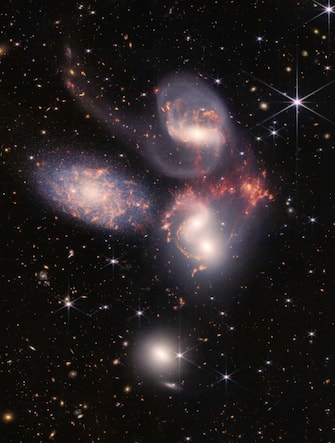 Today, NASA’s James Webb Space Telescope reveals Stephan’s Quintet, a visual grouping of five galaxies, in a new light. This enormous mosaic is Webb’s largest image to date, covering about one-fifth of the Moon’s diameter. It contains over 150 million pixels and is constructed from almost 1,000 separate image files. The information from Webb provides new insights into how galactic interactions may have driven galaxy evolution in the early universe. Image Credit: (NASA, ESA, CSA, and STScI)