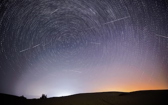 (210813) -- ORDOS, Aug. 13, 2021 (Xinhua) -- Photomontage taken on Aug. 13, 2021 shows the night sky during the Perseid Meteor Shower above an ecological demonstration zone of Engebei in Kubuqi Desert, north China's Inner Mongolia Autonomous Region. (Xinhua/Lian Zhen) - Lian Zhen -//CHINENOUVELLE_XxjpbeE007176_20210813_PEPFN0A001/2108131428/Credit:CHINE NOUVELLE/SIPA/2108131430