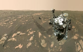 epa09121538 A handout photo made available by NASA shows NASAâ€™s Perseverance Mars rover taking a selfie with the Ingenuity helicopter, seen here about 13 feet (3.9 meters) from the rover in this image taken using its SHERLOC WATSON camera, on 06 April 2021, the 46th Martian day of the mission. Perseveranceâ€™s selfie with Ingenuity is made up of 62 individual images stitched together once they are sent back to Earth; they were taken in sequence while the rover was looking at the helicopter, then again while it was looking at the WATSON camera. The helicopter was released by the rover after being charged and is expected to fly in a dedicated fly zone no earlier than 08 April. Having landed on Mars on 18 February, Perseverance's main mission on Mars is astrobiology and the search for signs of ancient microbial life, according to NASA.  EPA/NASA/JPL-Caltech/MSSS/HANDOUT  HANDOUT EDITORIAL USE ONLY/NO SALES