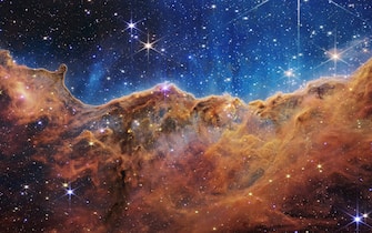(220712) -- GREENBELT (U.S.), July 12, 2022 (Xinhua) -- Image released by NASA on July 12, 2022 shows the edge of a nearby, young, star-forming region called NGC 3324 in the Carina Nebula. Captured in infrared light by NASA's James Webb Space Telescope, the image reveals for the first time previously invisible areas of star birth. NASA released James Webb Space Telescope's first full-color images of the universe and their spectroscopic data on Tuesday, revealing the unprecedented and detailed views of the universe. (NASA, ESA, CSA, STScI/Handout via Xinhua) - NASA, ESA, CSA, STScI -//CHINENOUVELLE_071302/2207130724/Credit:CHINE NOUVELLE/SIPA/2207130902